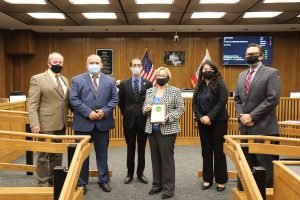 Barbary Levey, at center, with Merced County Supervisors Loyd Pareira, Rodrigo Espinoza, Scott Silveira, Lee Lor and Daron McDaniel. Levy was honored at Tuesday’s board meeting with a county plaque for her decades of service.